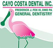 The image shows a logo for 'CAYO COSTA DENTAL INC.' with the text 'FREDERICK J. FOX, III, DMD GENERAL DENTISTRY' beneath it. A flamingo is depicted in front of a pink and white background that resembles a stylized sunset or sunrise. The logo appears to be for a dental practice named CAYO COSTA DENTAL INC., with the name of the owner, Frederick J. Fox III, and his qualifications as a dentist.